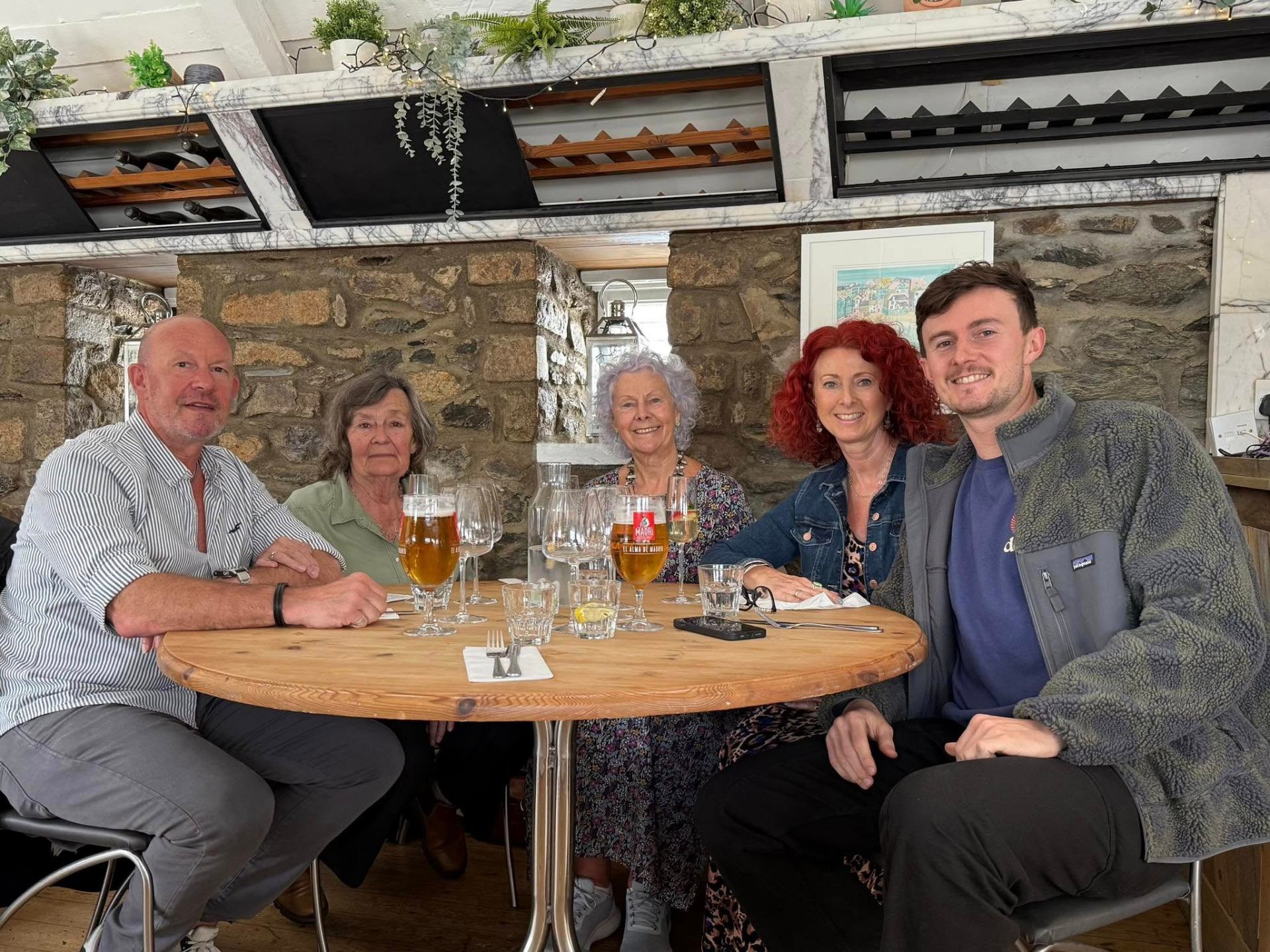 The Jumble Dream family around a table in Cornwall — three generations of the family who run the business